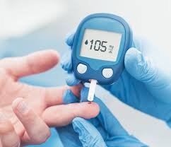 clinical pharmacist in a diabetes clinic measuring blood sugar